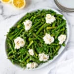 Spring Pea and Asparagus Salad with Ricotta on a serving platter.