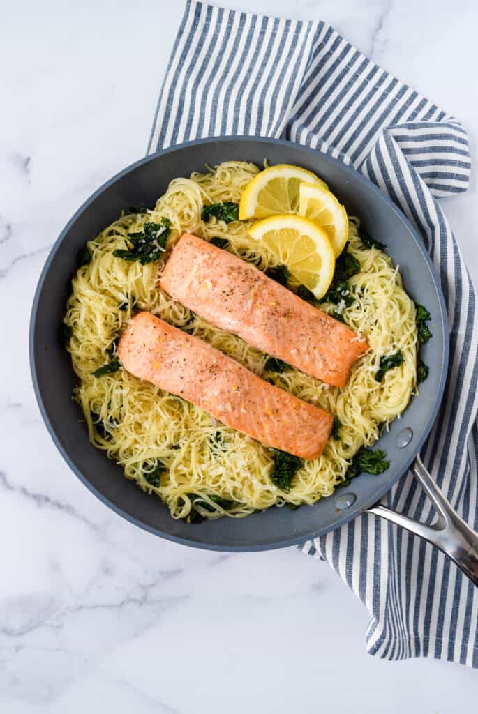 Lemon Kale Pasta with Salmon in a skillet.