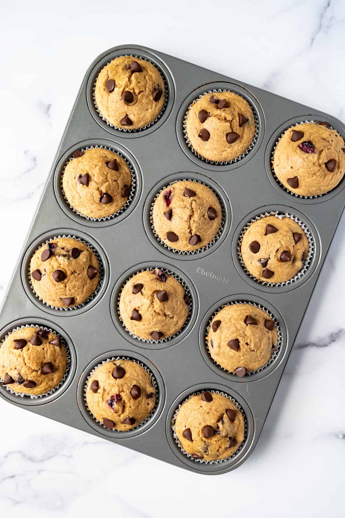 Cherry Chocolate Chip Muffins in a muffin tin.