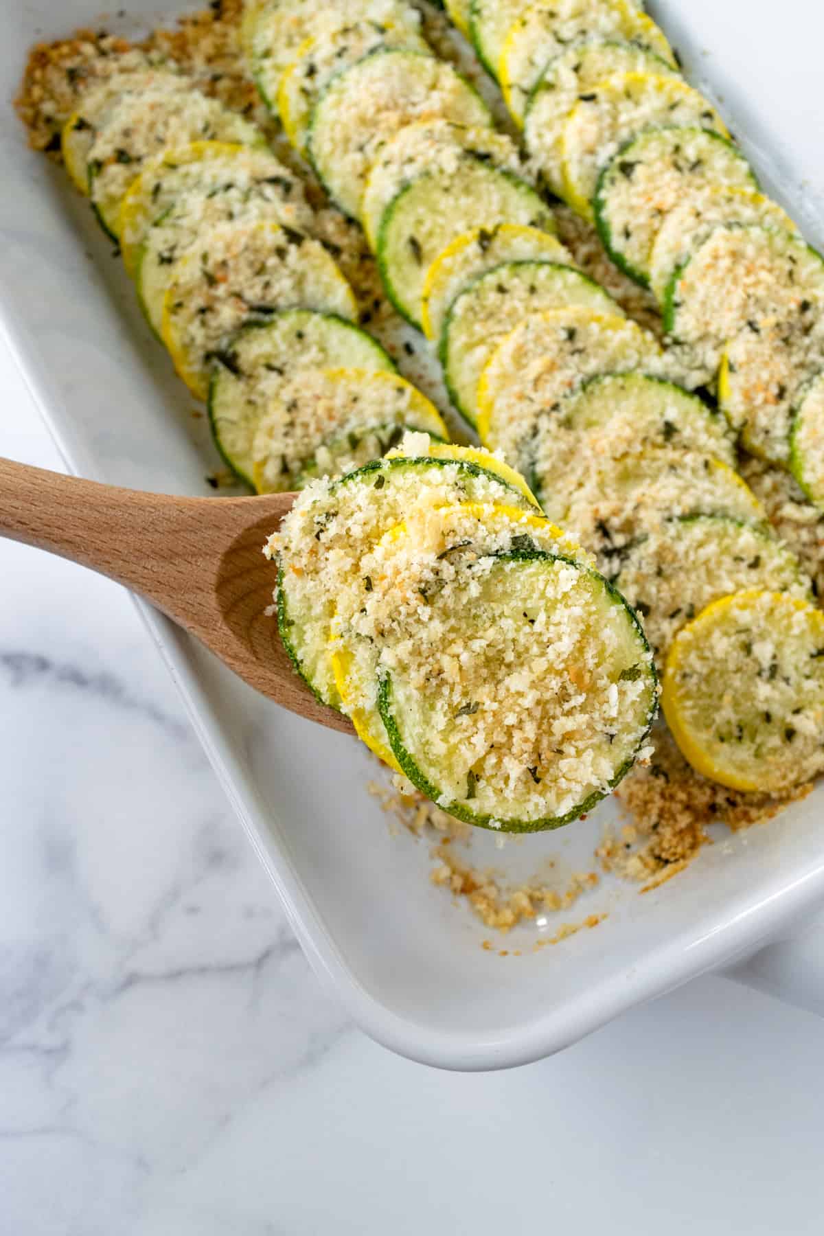 Zucchini and Squash Bake with a serving spoon.