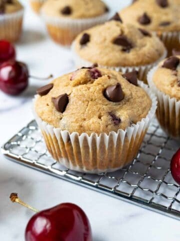 Cherry Chocolate Chip Muffins on a wire rack.
