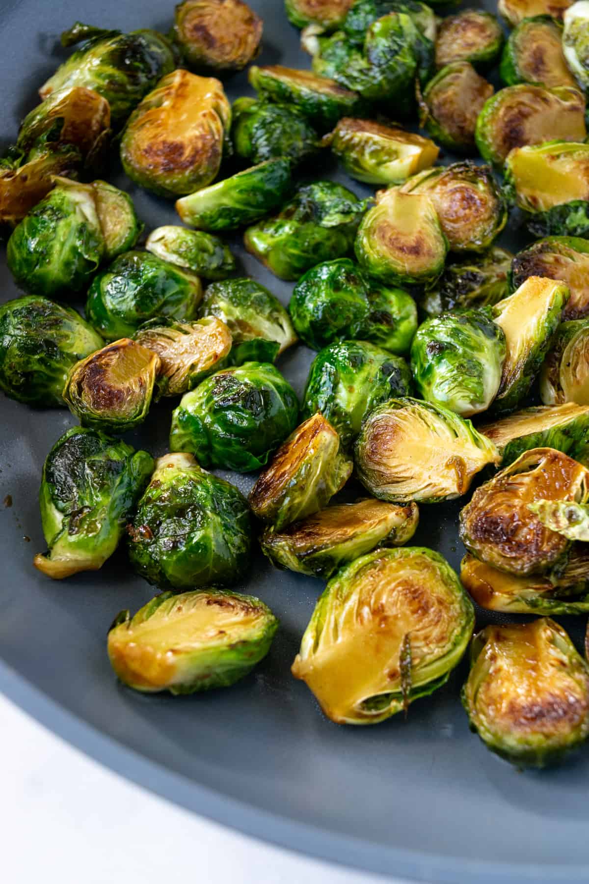 Maple Balsamic Brussels Sprouts in a skillet.