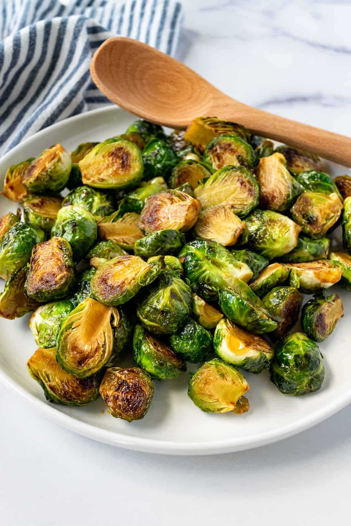 Maple Balsamic Brussels Sprouts on a white serving plate.