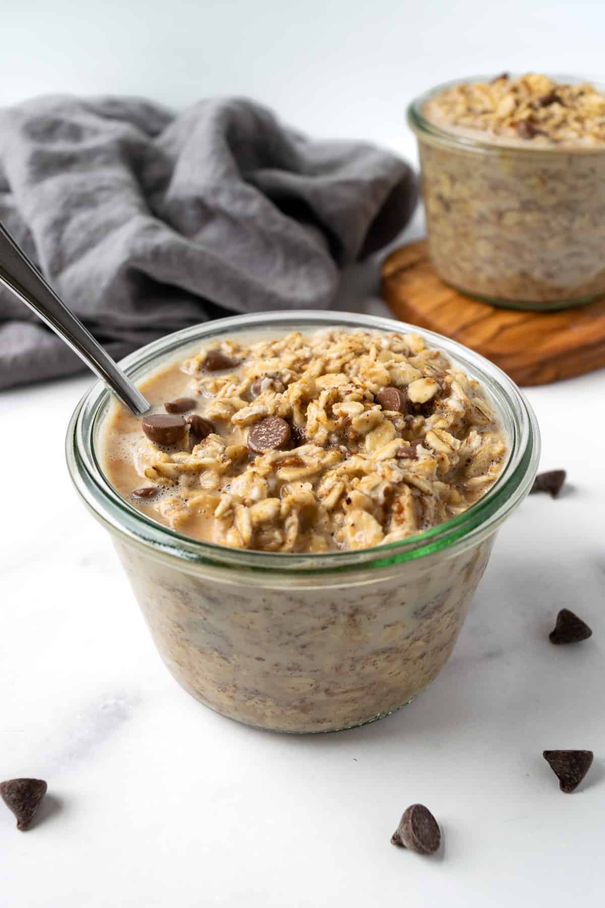 Cookie Dough Overnight Oats in a glass jar on a table.