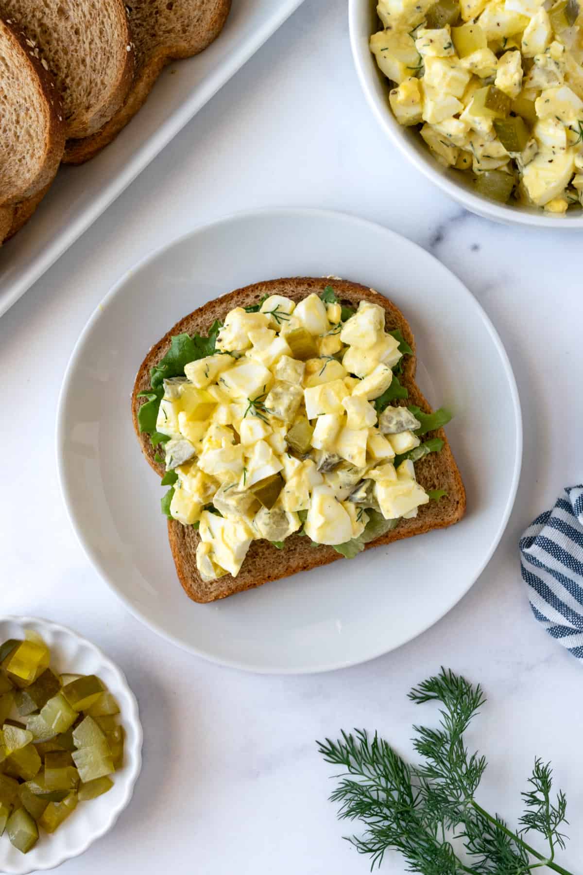 Egg Salad with Pickles on wheat toast.