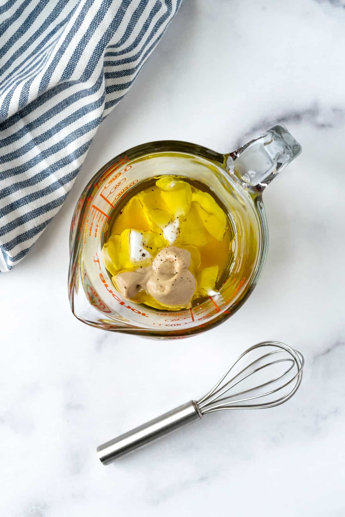 Yogurt Honey Mustard Dressing Ingredients in a Glass Measuring Cup.