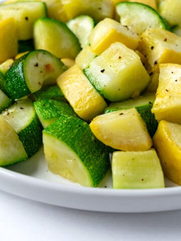 Air Fryer Zucchini and Squash on a white plate.