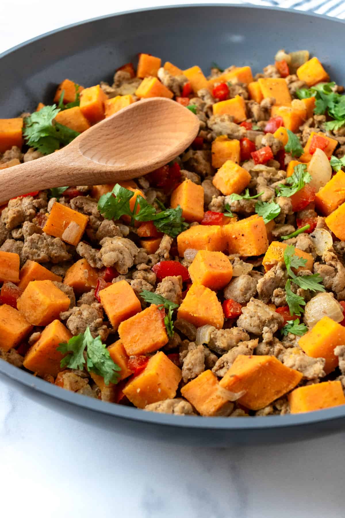 Closeup of Turkey Hash with Sweet Potatoes in a Skillet.