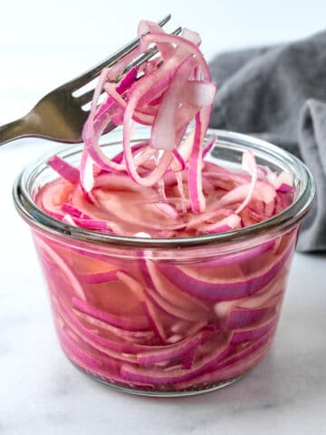 Quick Pickled Red Onions with a Fork.