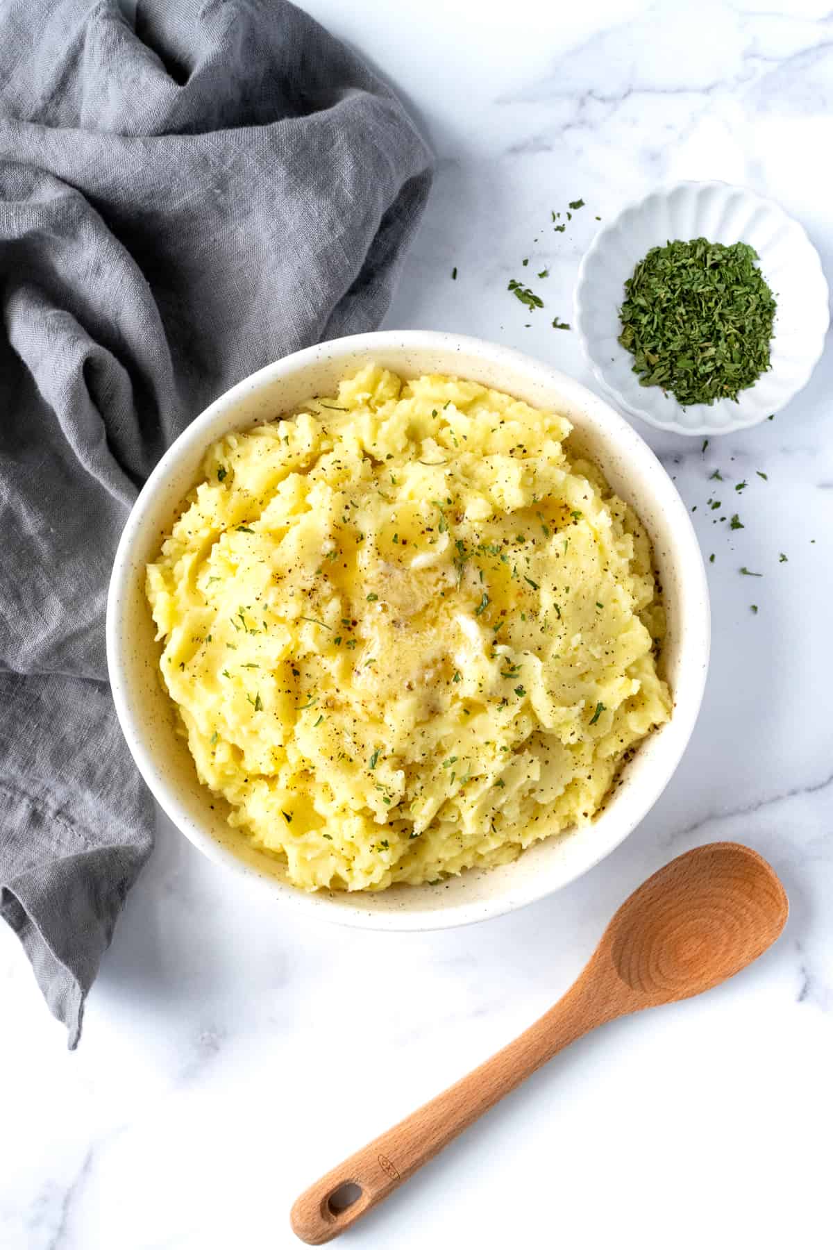 Mashed Potatoes in a White Serving Bowl.