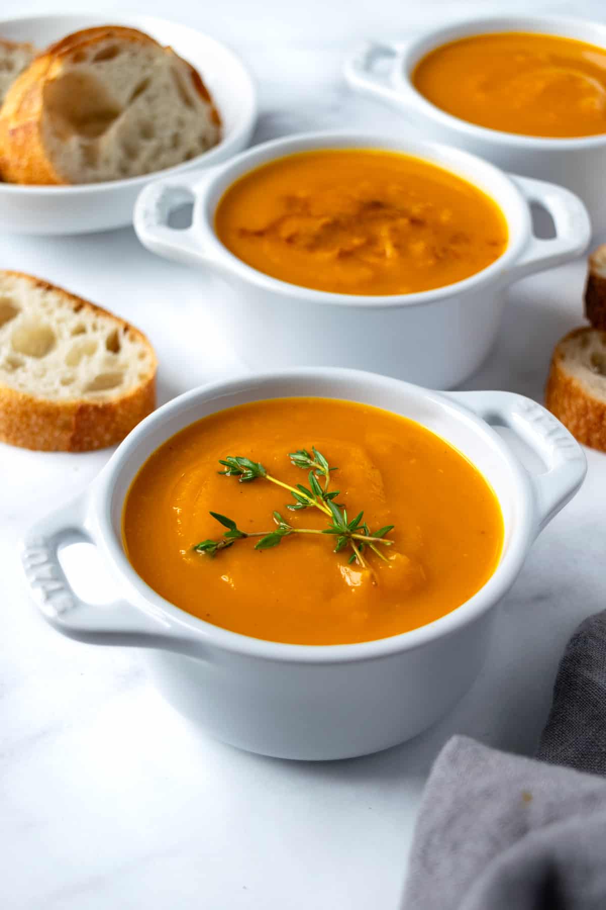 Honeynut Squash Soup in small white bowls.