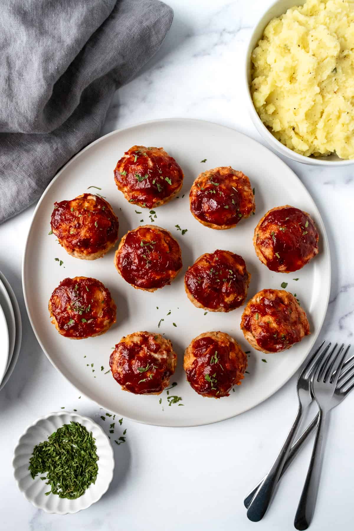 Mini Turkey Meatloaves on a white serving plate.