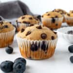 Blueberry Chocolate Chip Muffins on a marble counter.