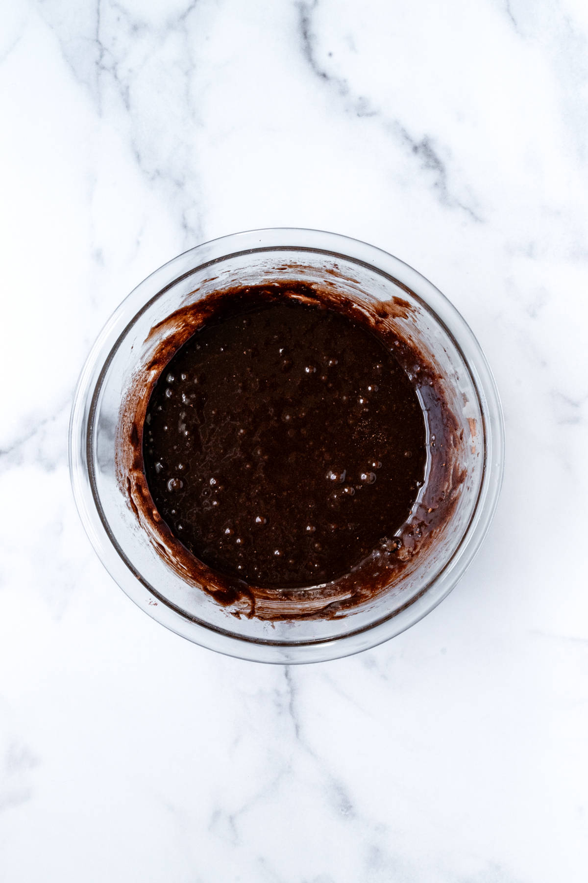Brownie Batter in a glass mixing bowl.