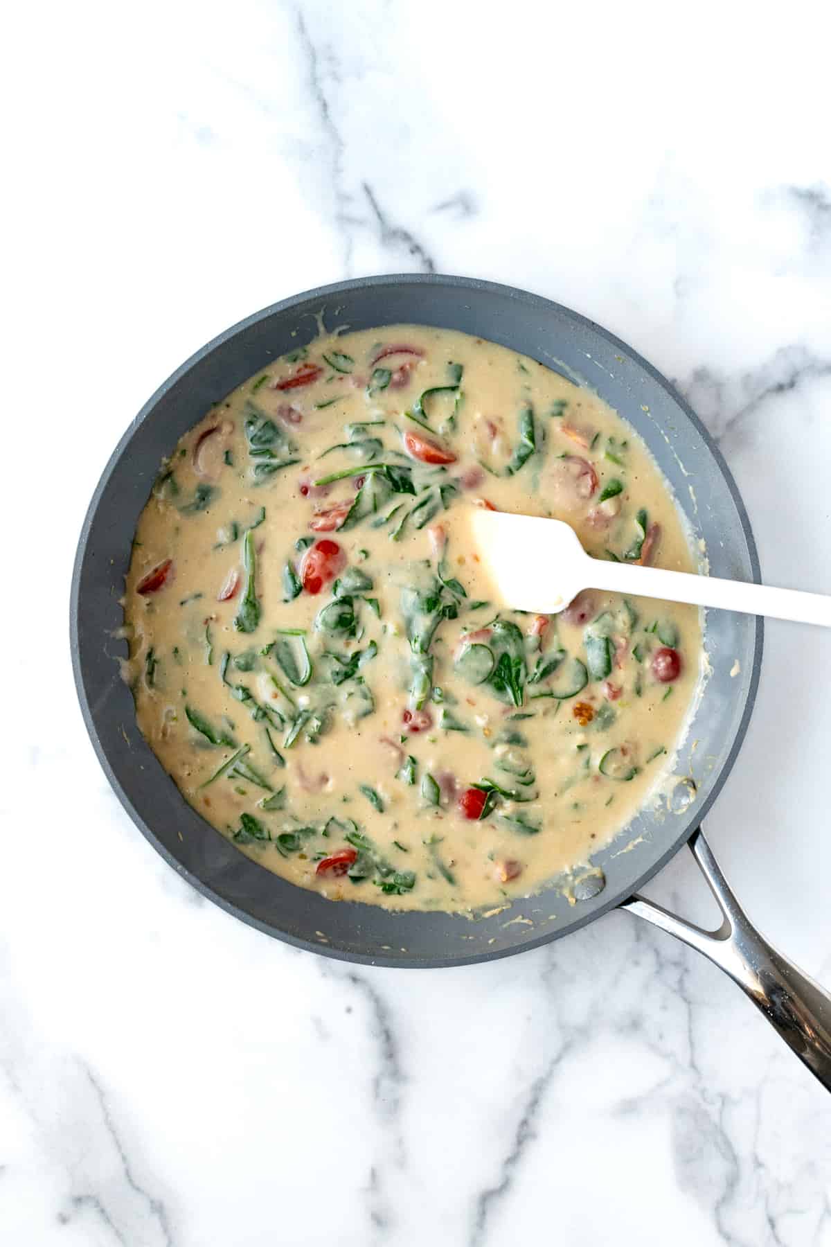 Creamy Chicken Florentine Sauce in a Skillet.