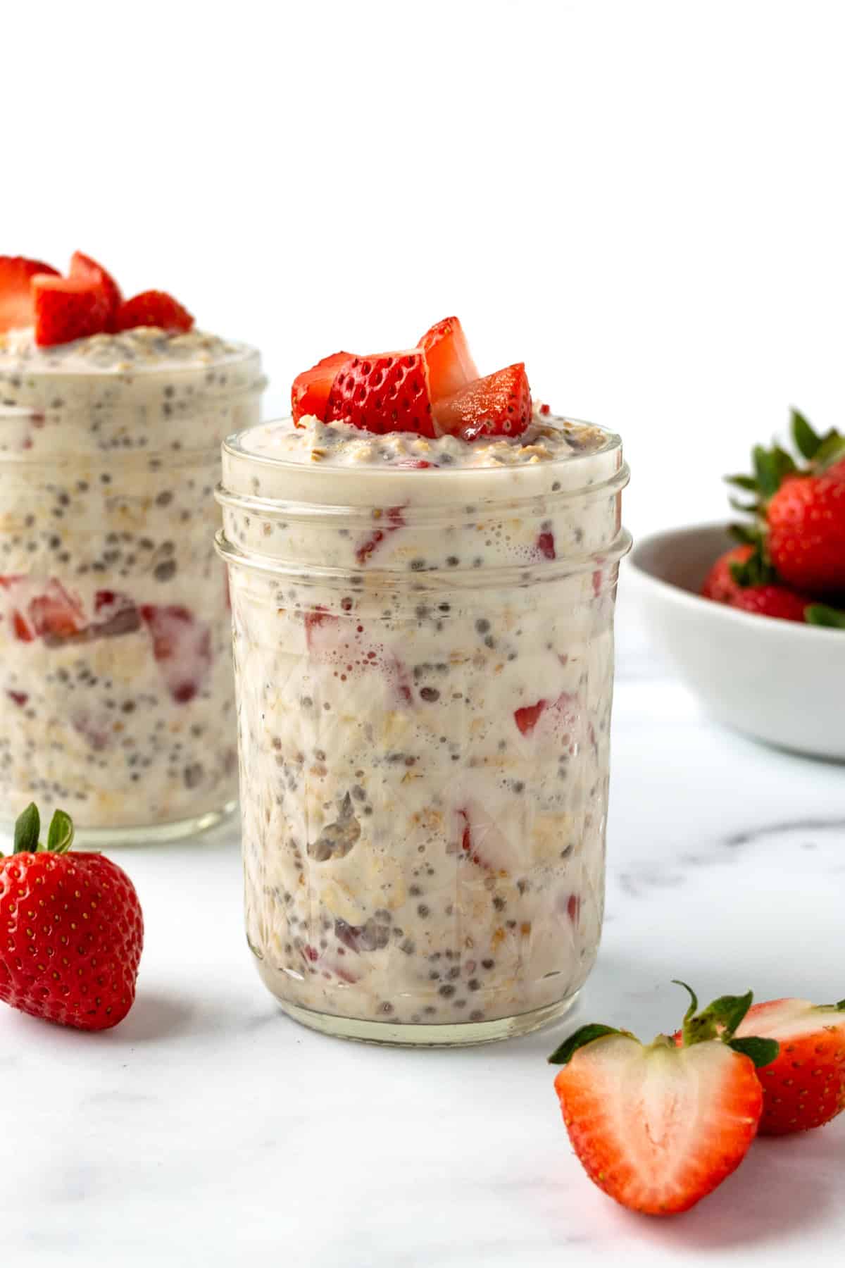 Strawberries and Cream Overnight Oats in a glass jar.