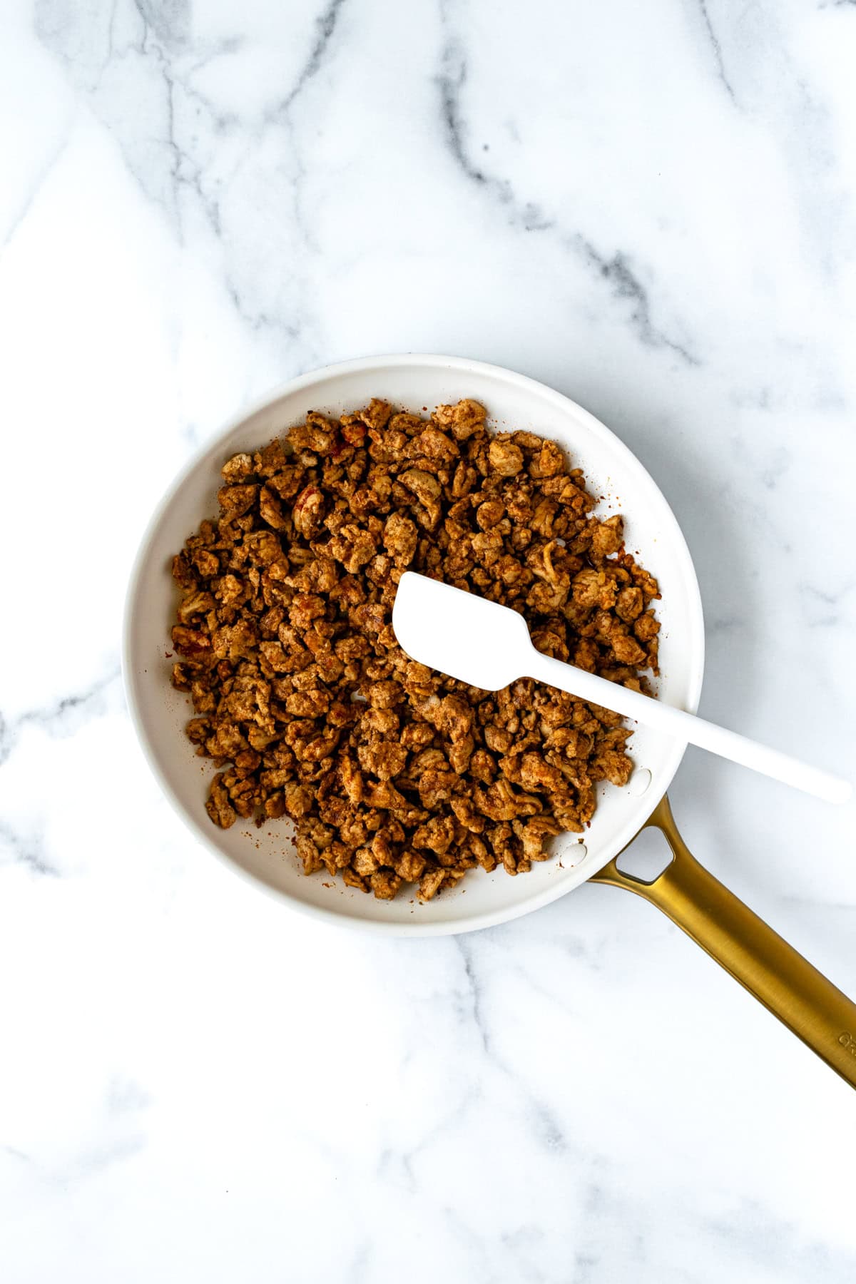 Ground Turkey Taco Meat in a white skillet.