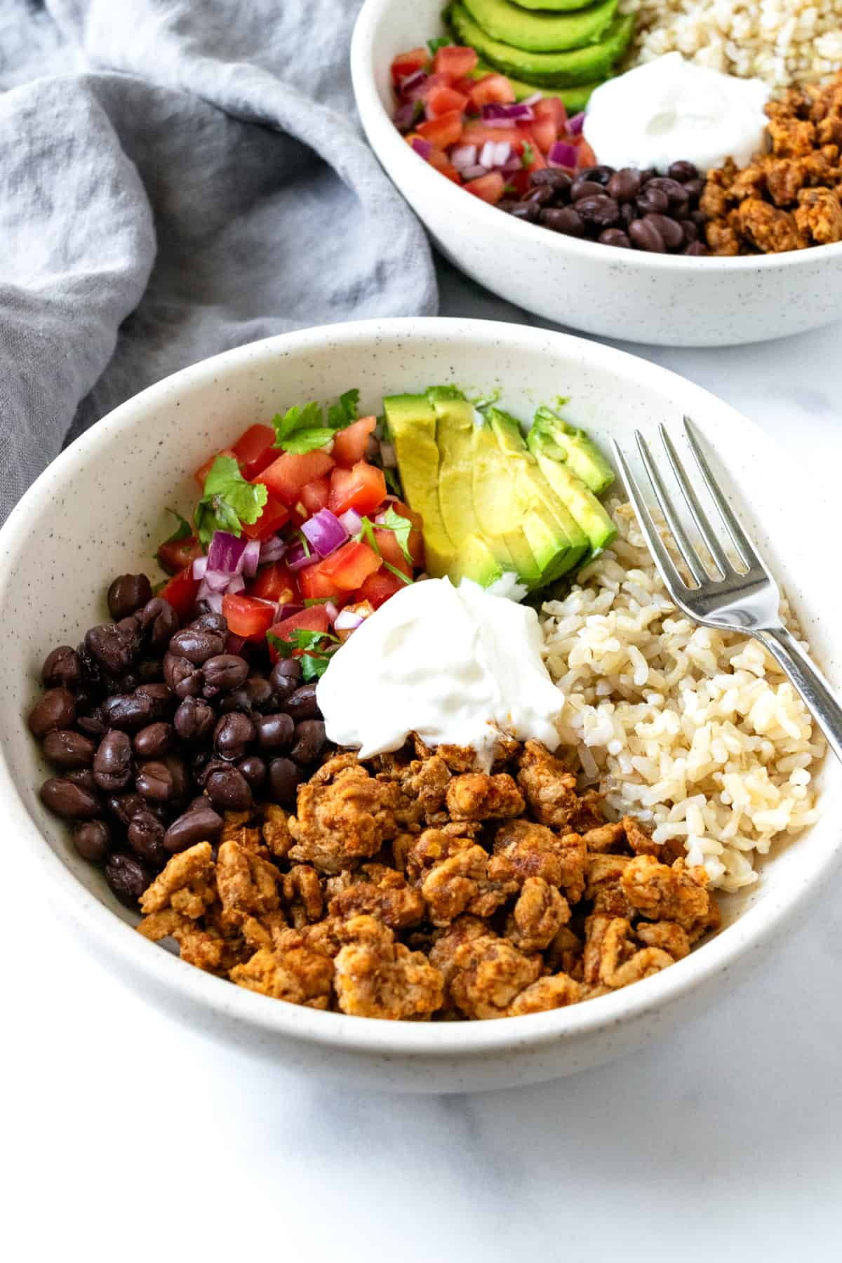 Turkey Burrito Bowls on a marble counter.