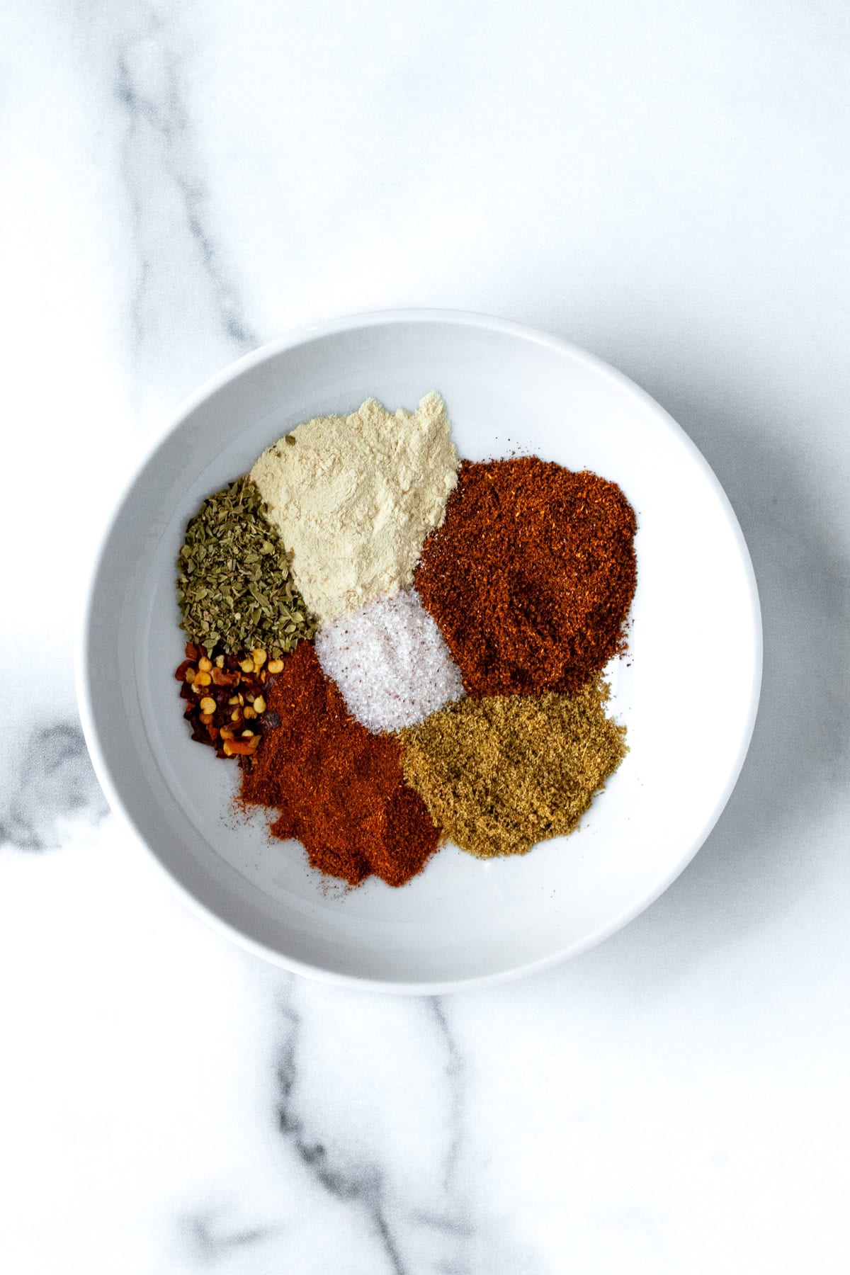 Ground Turkey Taco Seasoning Ingredients on a small white plate.