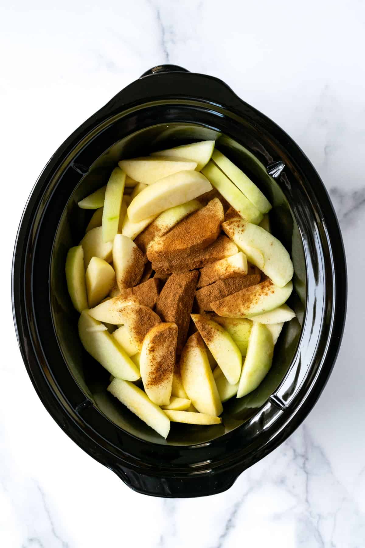 Cinnamon Applesauce Ingredients in a Slow Cooker.