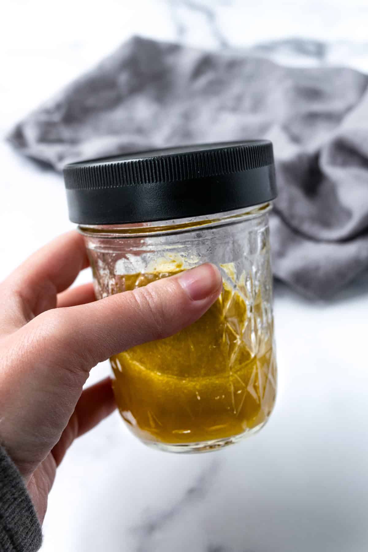 Maple Cider Vinaigrette in a glass jar.