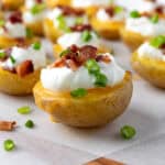 Baked Potato Bites on parchment.