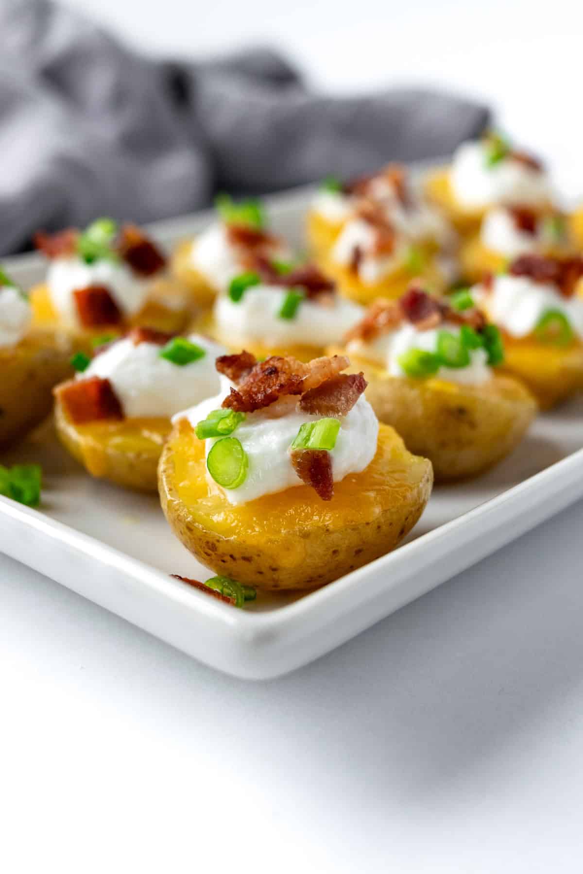 Potato Bites on a white serving plate.