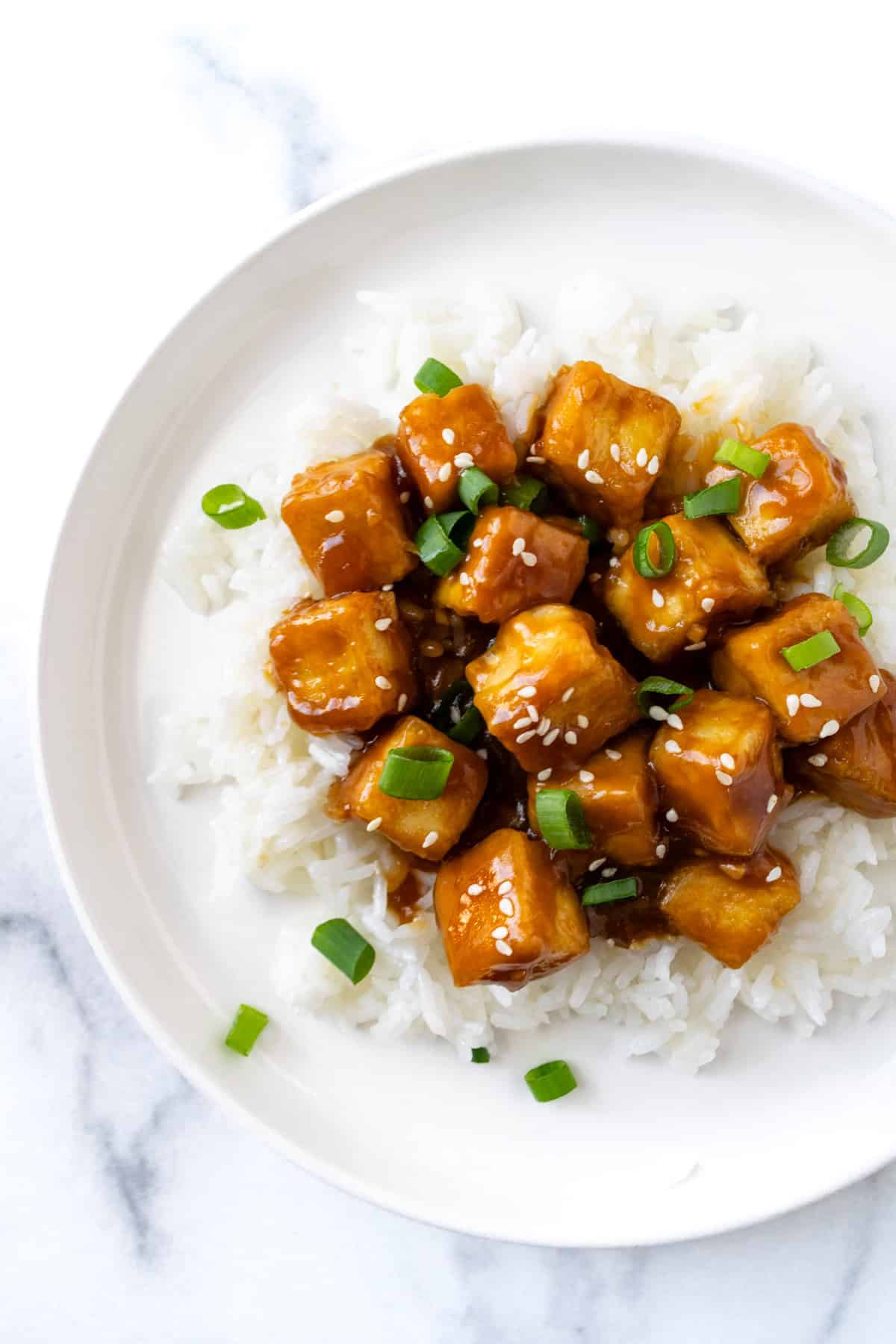 Orange Tofu on white rice.