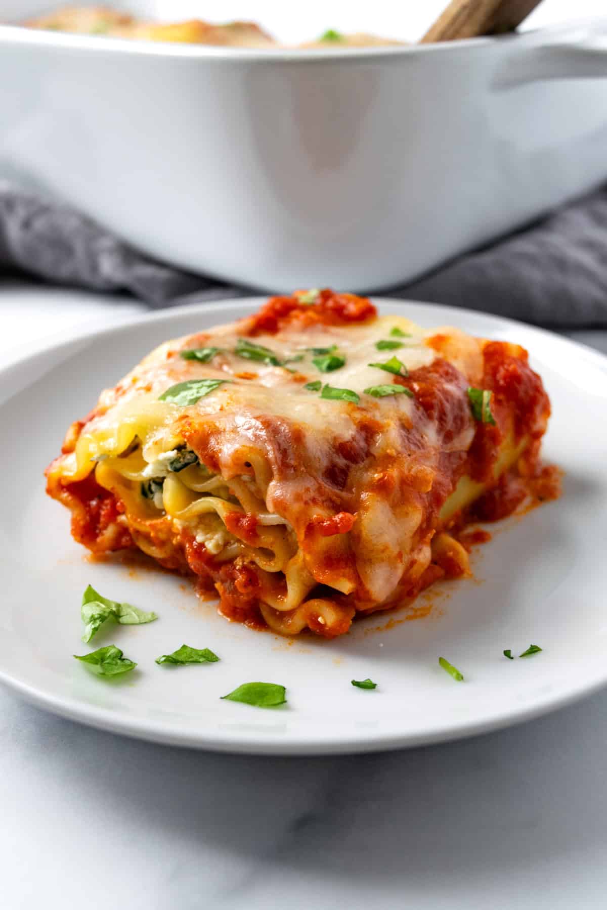 A Spinach Lasagna Roll on a Plate.