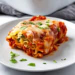 Spinach Lasagna Roll on a white plate.