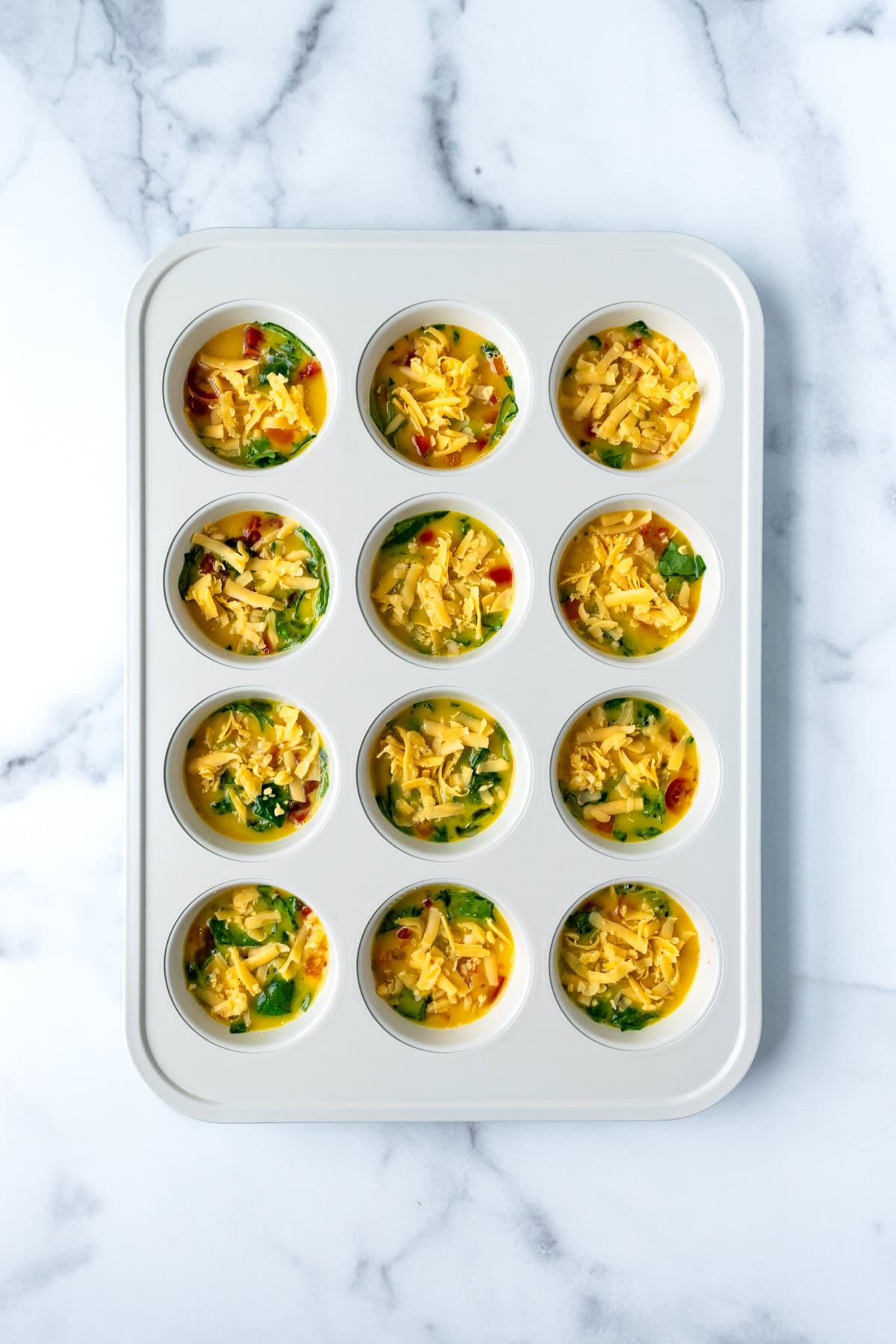 Egg Bites in Muffin Tin Before Baking.