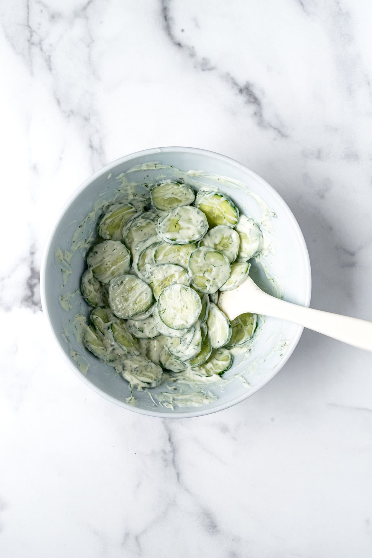 Greek Yogurt Cucumber Salad in a white bowl.