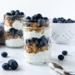 Blueberry Parfaits in glass jars.