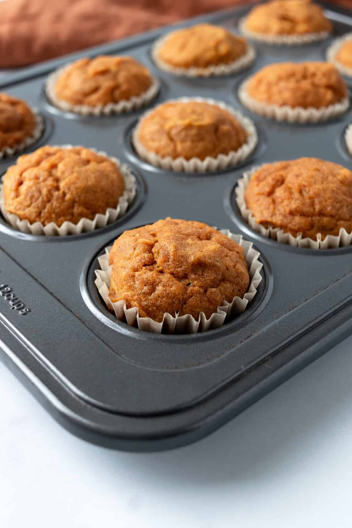 Easy Mini Pumpkin Muffins in Muffin Tin.