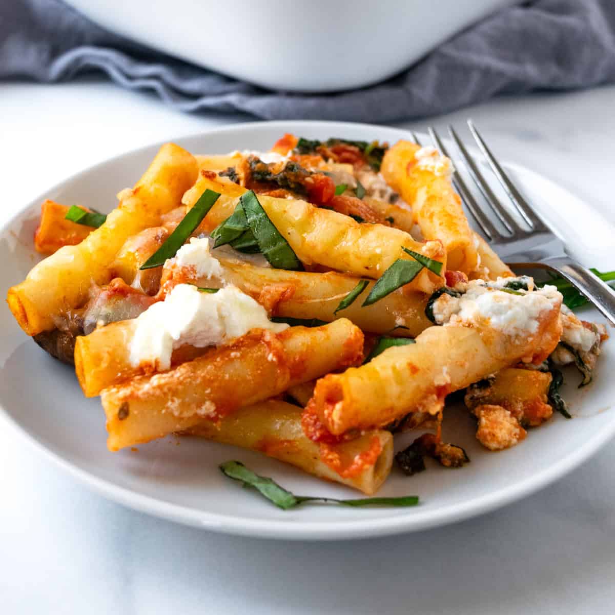 Vegetable Baked Ziti on a white plate with a fork.