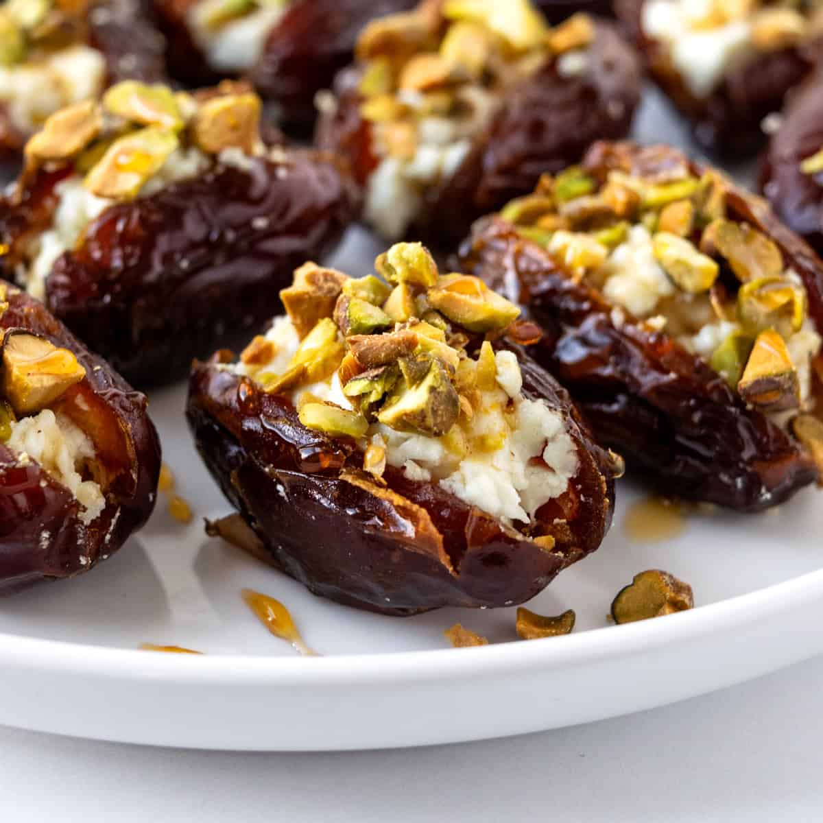 Goat Cheese Stuffed Dates on a white plate.