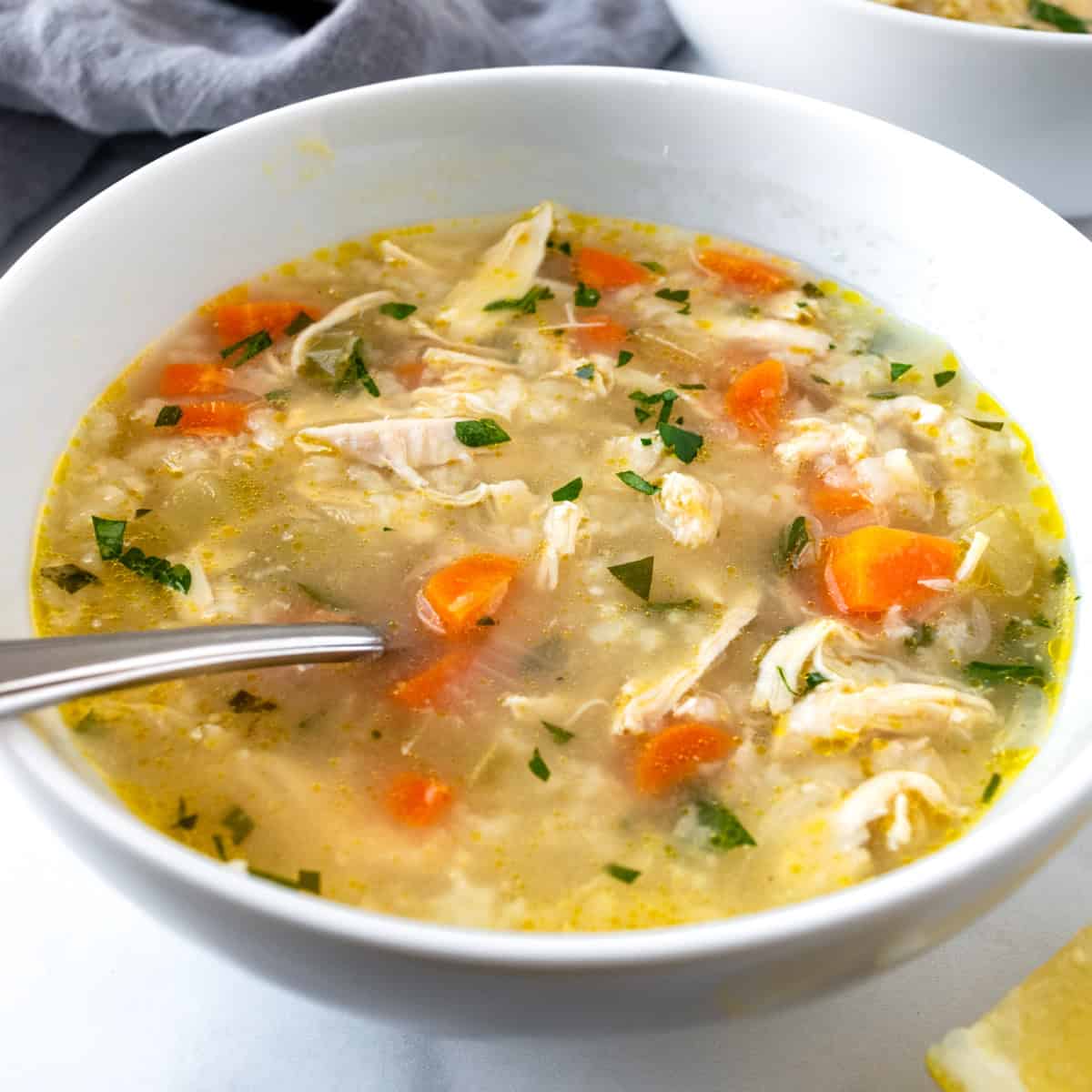Lemon Chicken and Rice Soup in a white bowl.