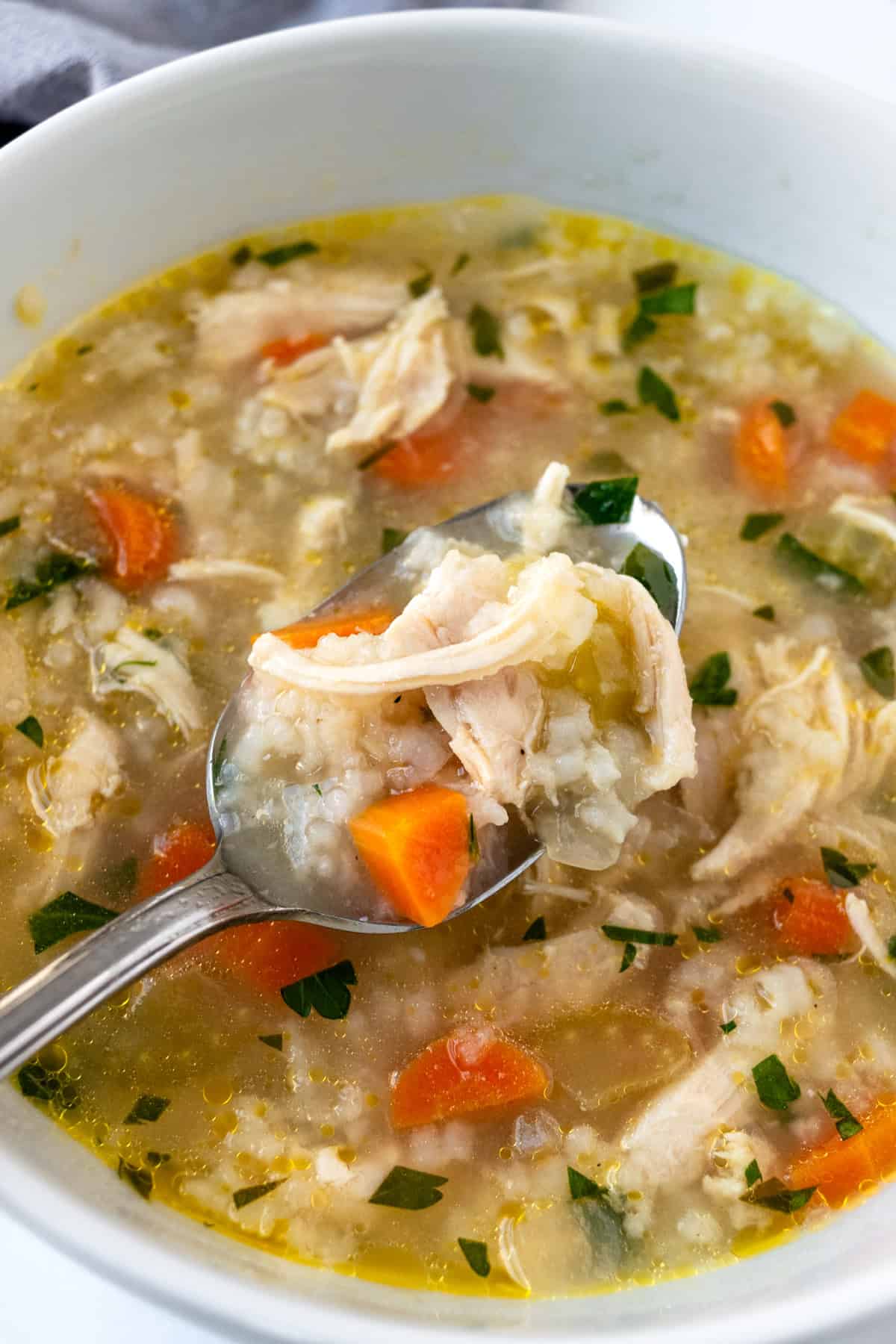 Spoonful of lemon chicken and rice soup.