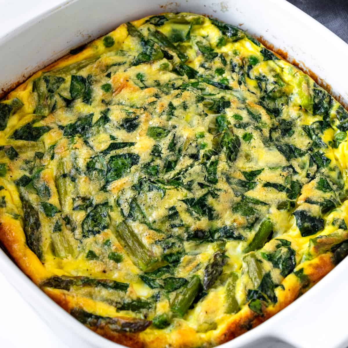 Spring Veggie Egg Bake in a white baking dish.
