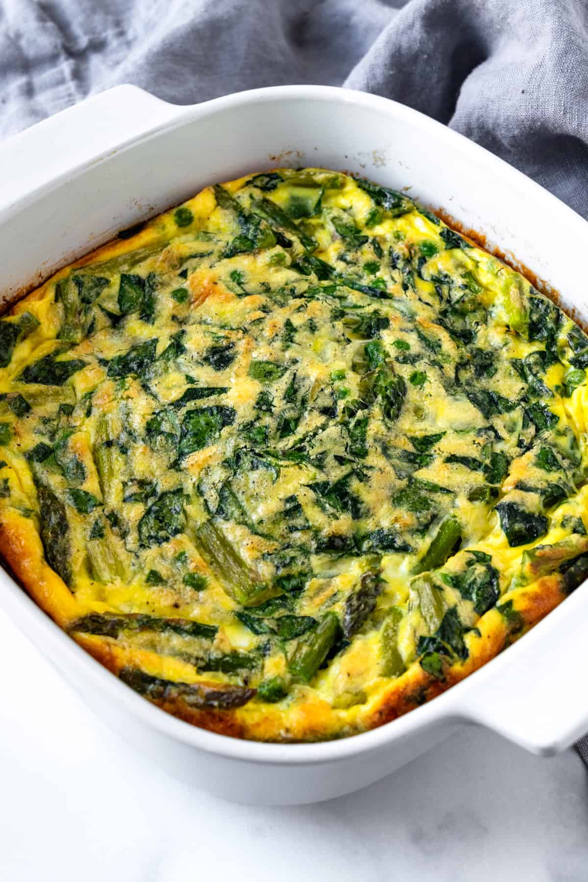 Spring Veggie Egg Bake in a white baking dish.