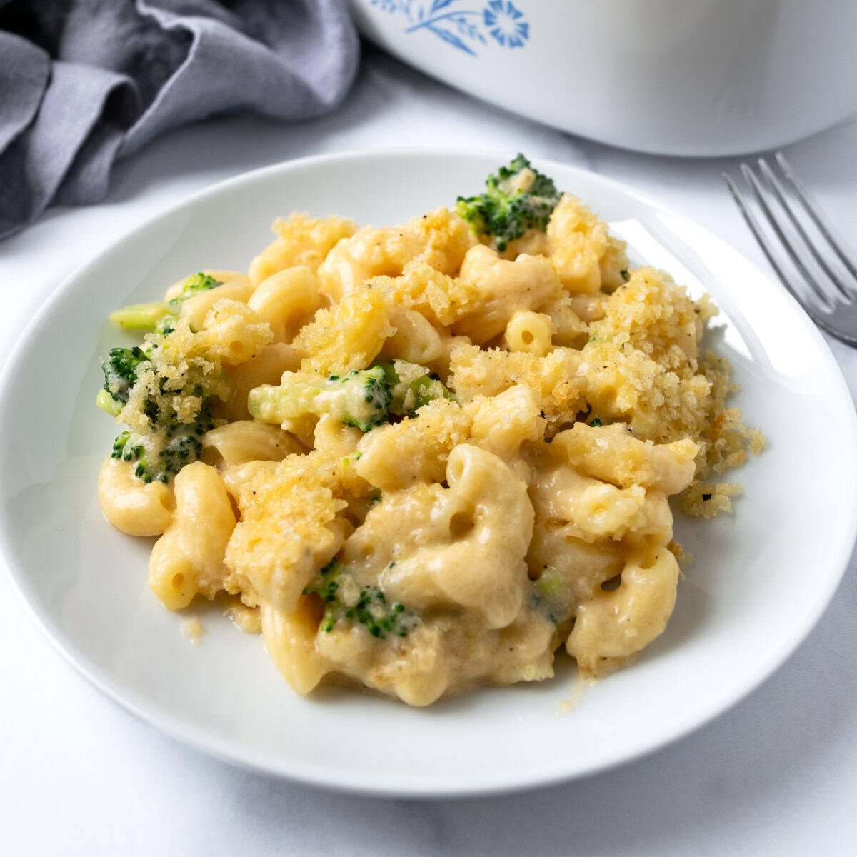 Baked Broccoli Mac and Cheese on a white plate.
