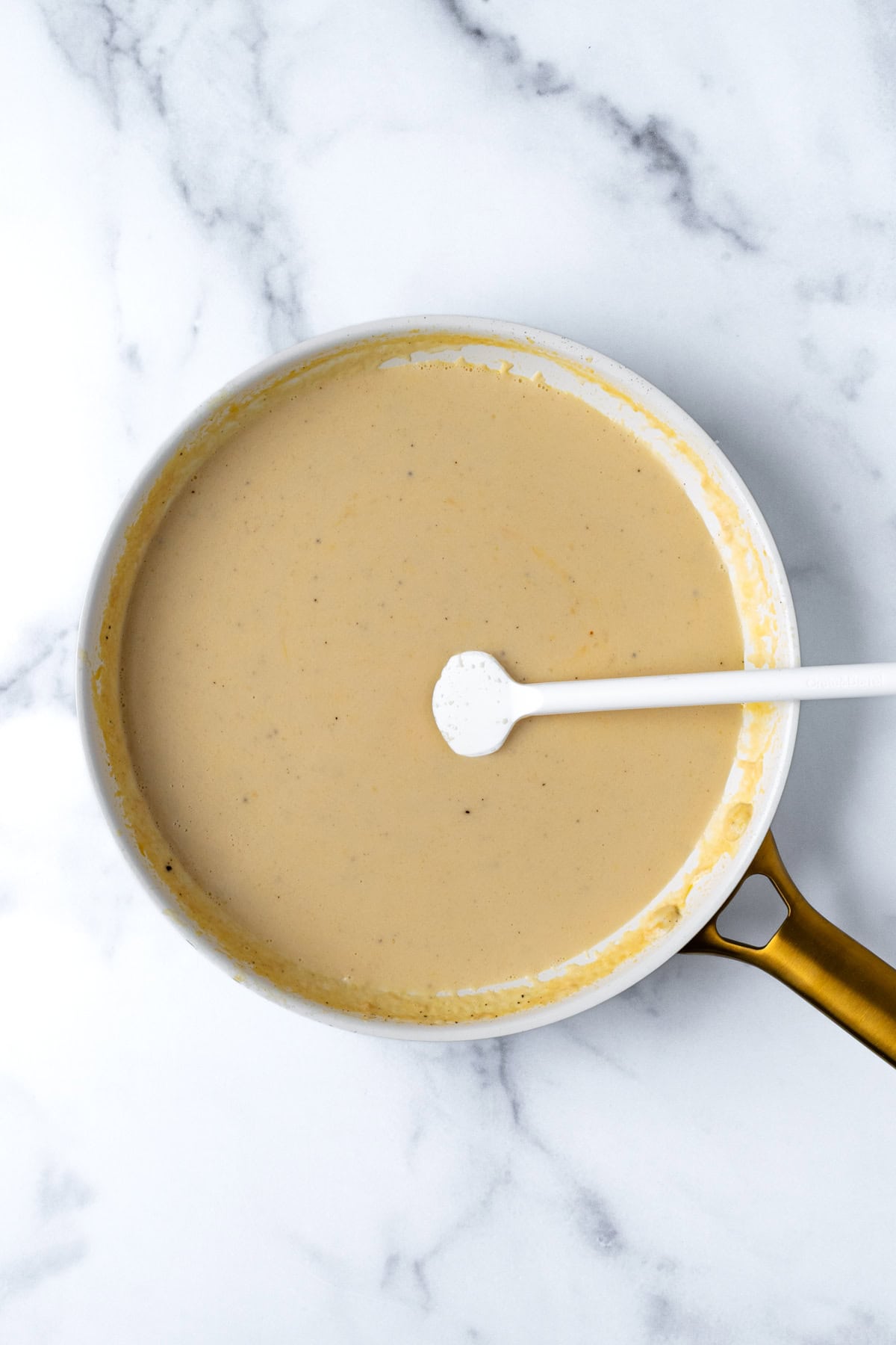 Broccoli Mac and Cheese Sharp Cheddar Cheese Sauce in a white skillet.