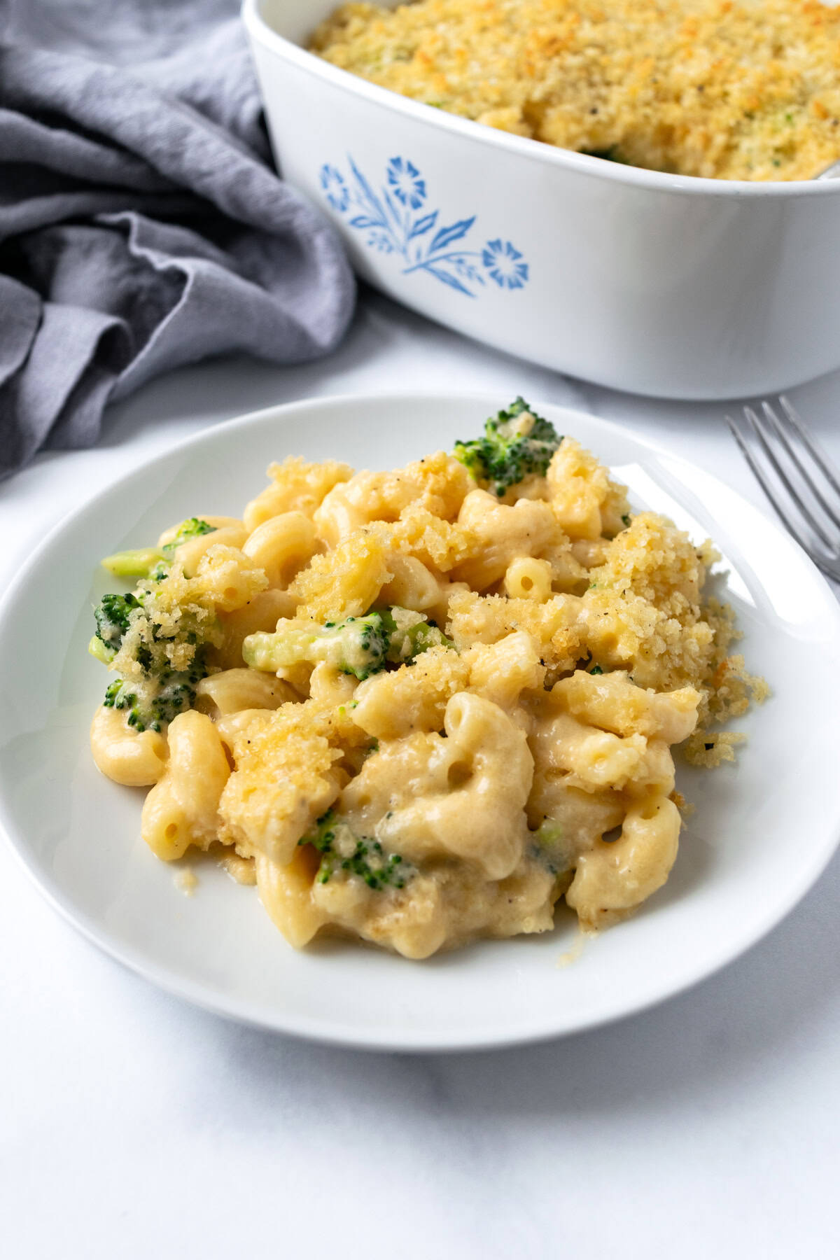 Baked Broccoli Mac and Cheese on a white plate.
