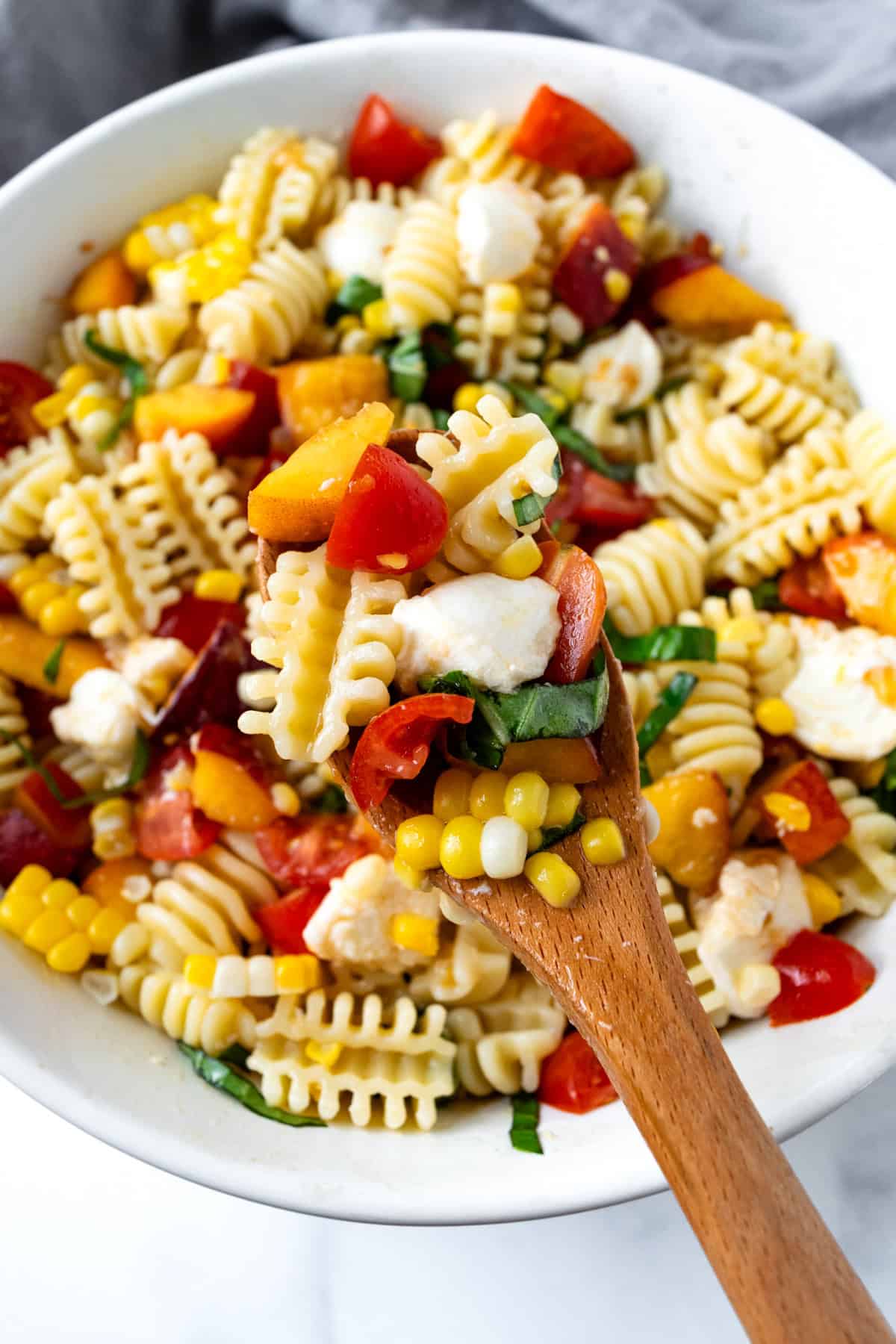 A Spoonful of Peach and Corn Pasta Salad.